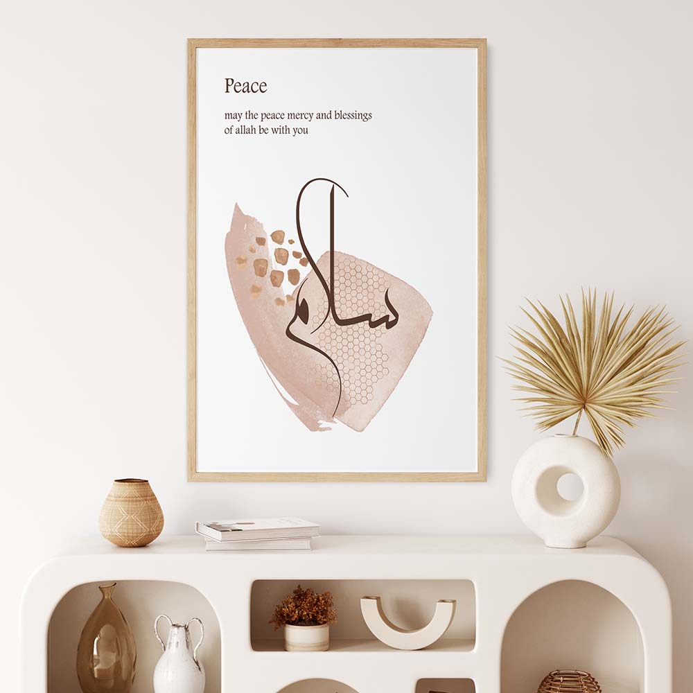 a framed poster of Arabic calligraphy, a white shelf with various decorative items, and a potted plant on a white shelf.