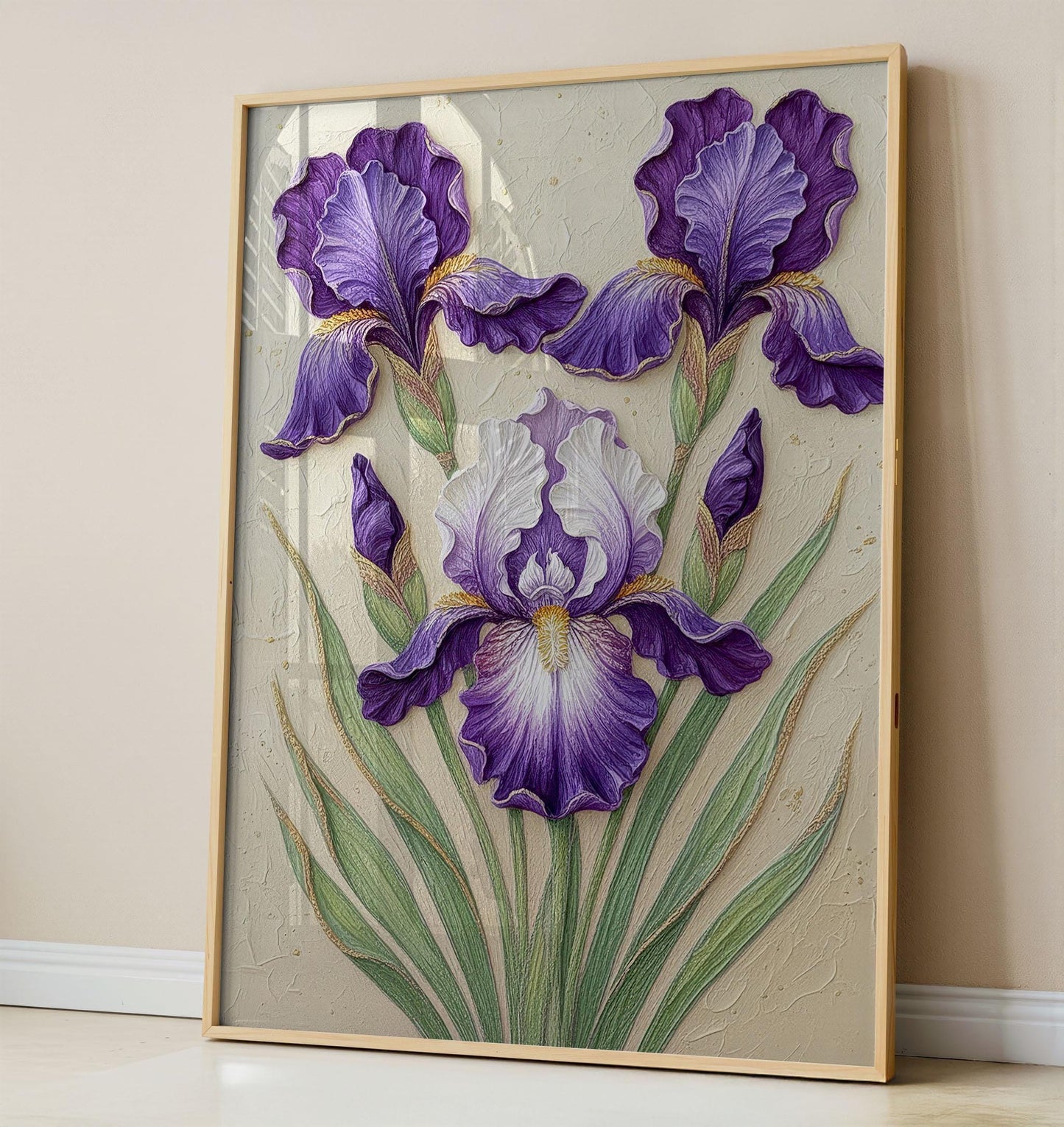 A highly textured 3D oil painting of three purple and white iris flowers. The artwork features thick sculptural petals with intricate ridges and green leaves with gold-edged outlines on a neutral, off-white plaster-style background.